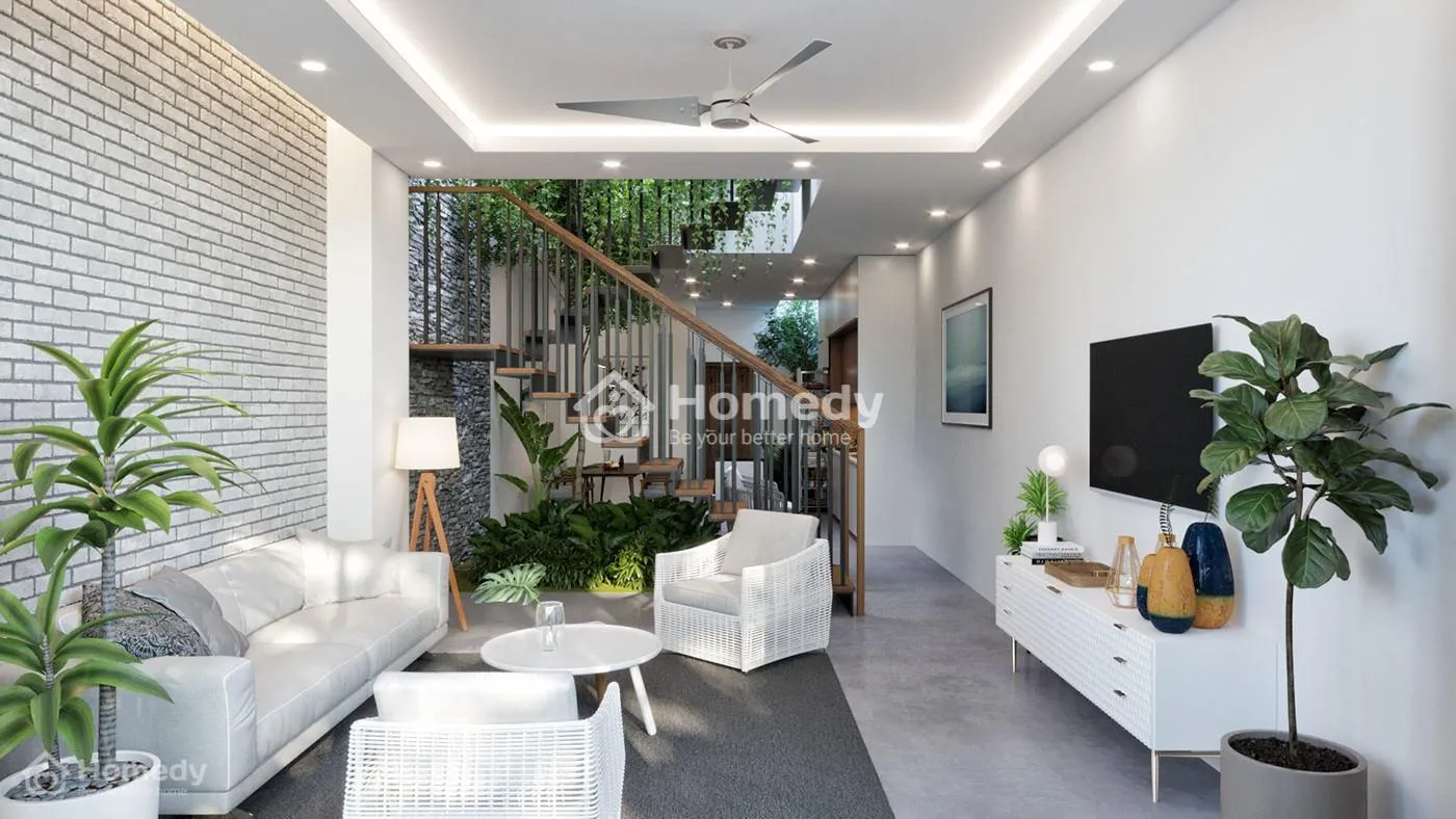 Cầu thang phòng khách nhà ống đặt ở giữa nhà để phân chia không gian