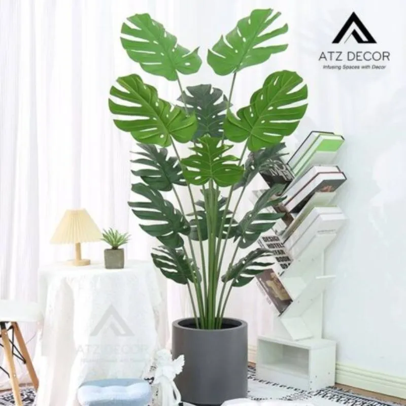Cây Monstera lá rách giả trang trí quán cafe sang trọng