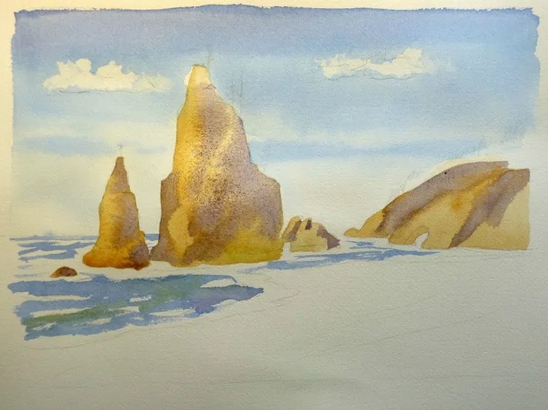 Phủ lớp màu nền đầu tiên cho các khối đá trong tranh tô màu nước biển